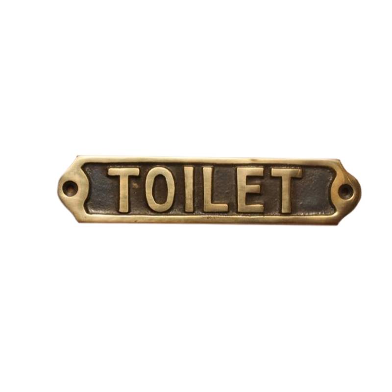 Tekstskilt med teksten: "Toilet"