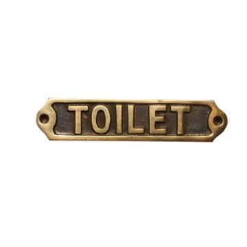 Tekstskilt med teksten: "Toilet"